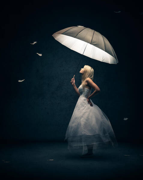 Wall Art - Photograph - Girl with umbrella and falling feathers by Johan Swanepoel