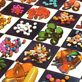 Various Pills on Checkerboard by CSA Images